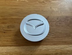 Wheel caps caps with Mazda logo YS1035N015