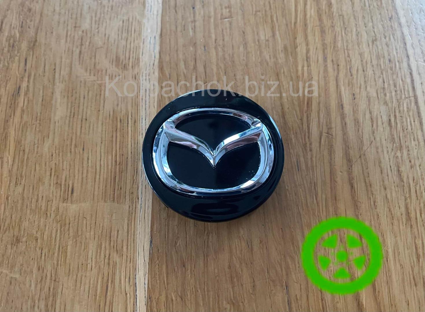 Оригинальный колпачок на диски Mazda C830-V3-815