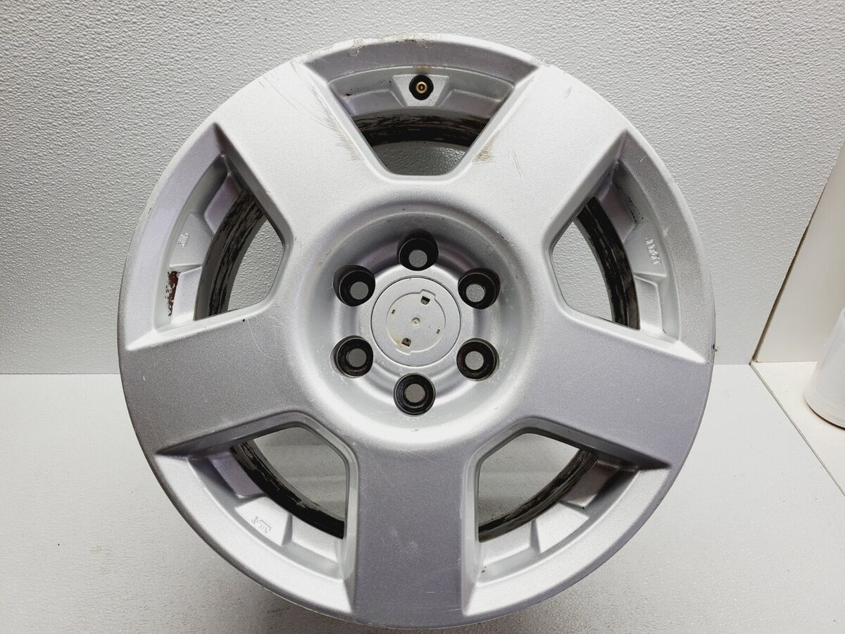 Nissan Center Cap 40342-EA210 (Genuine) – 70mm – Xterra, Frontier, Pathfinder, Titan, Armada
