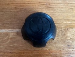 Оригинальный колпачок на диски Toyota HiLux 42603-0K110