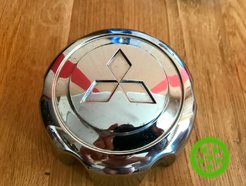 Wheel center caps Mitsubishi Montero Pajero 085618BM (original)